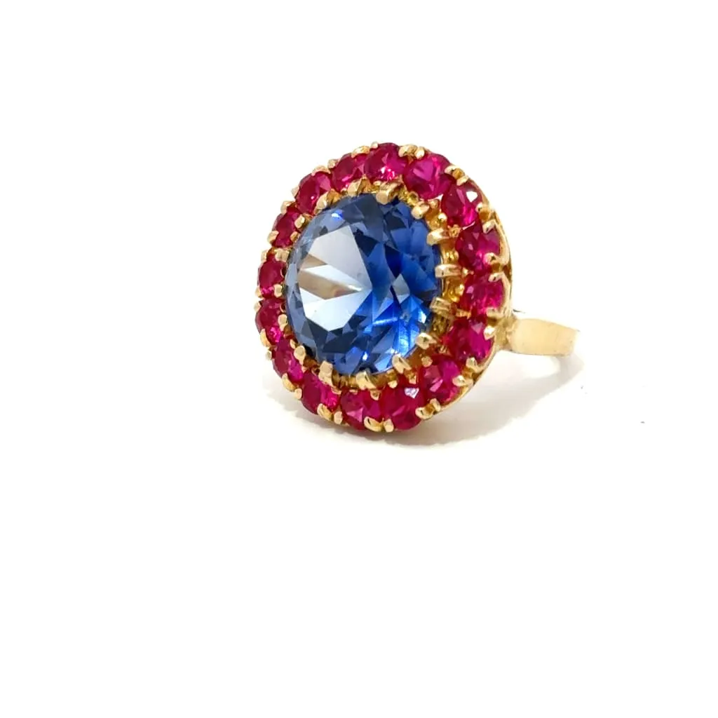 Blue And Red Gemstones On A Gold Ring
