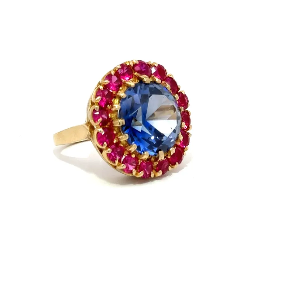 Blue And Red Gemstones On A Gold Ring
